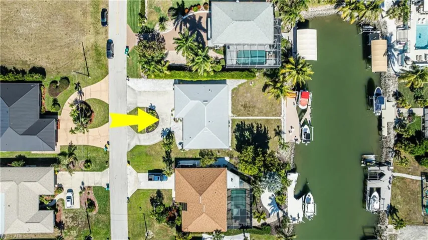 Aerial view of residential area featuring a large body of water