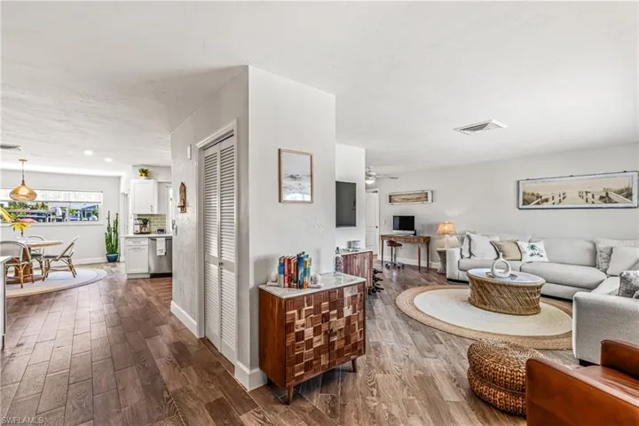 Dining room featuring wood tiled floors and baseboards