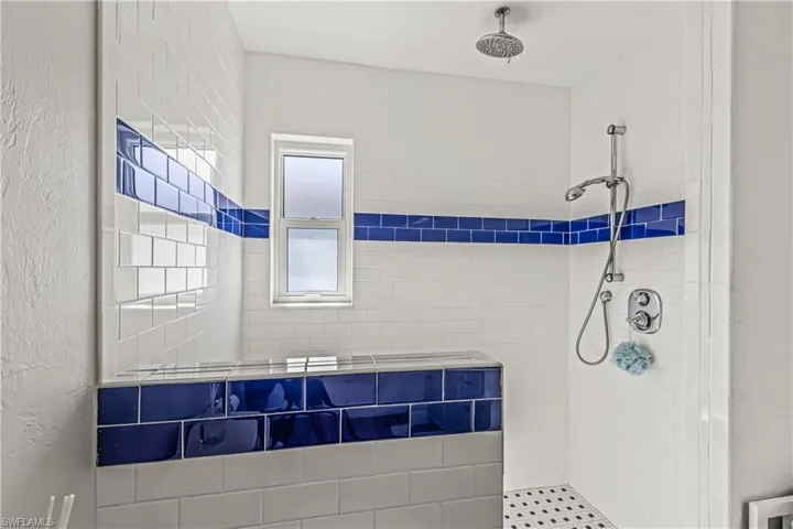 Full bath featuring a shower with curtain and vanity