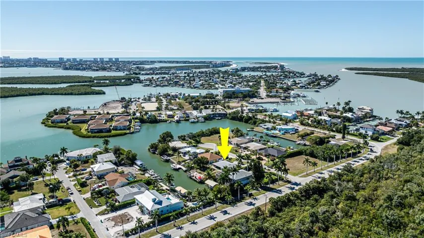 Aerial view of residential area with a nearby body of water