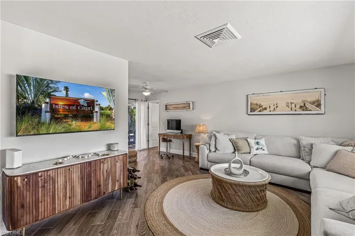 Office area featuring wood finished floors and ceiling fan