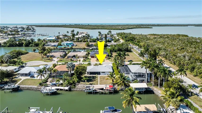 Aerial perspective of suburban area with a nearby body of water