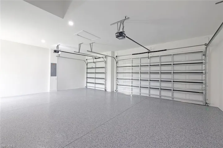 Garage with a garage door opener and electric panel