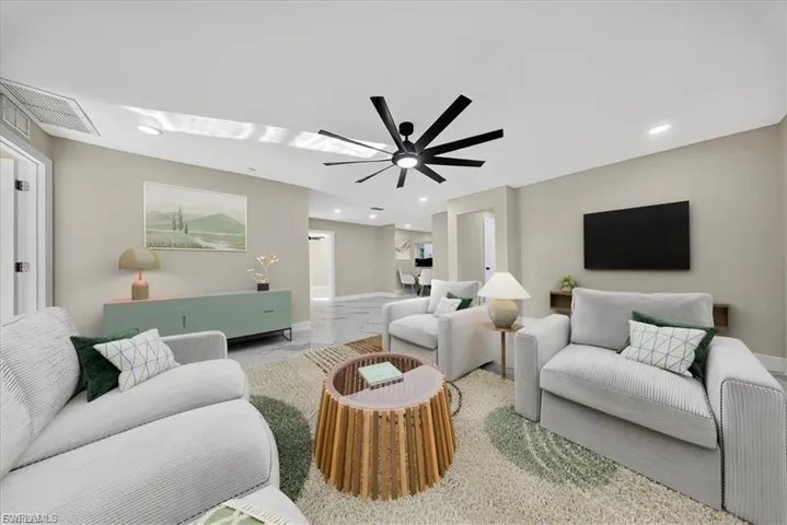 Recessed lighting, contemporary ceiling fan, light-toned wall finishes, and tile flooring