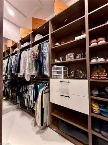 Walk in closet featuring attic access