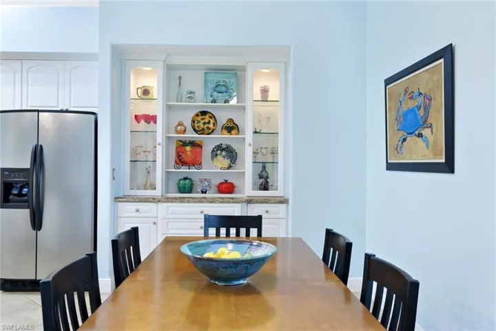 Dining area featuring a built in hutch.