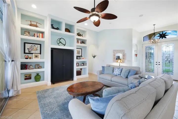 Spacious living room with classic built-in shelving display.