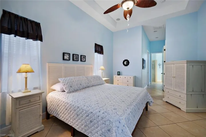 Primary bedroom features a tray ceiling. Also has walk-in closets.