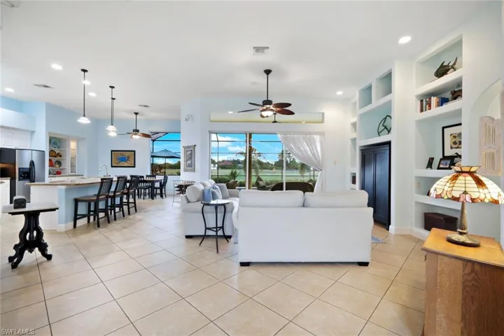 Great Room with 11 foot ceilings has an abundance of natural light.