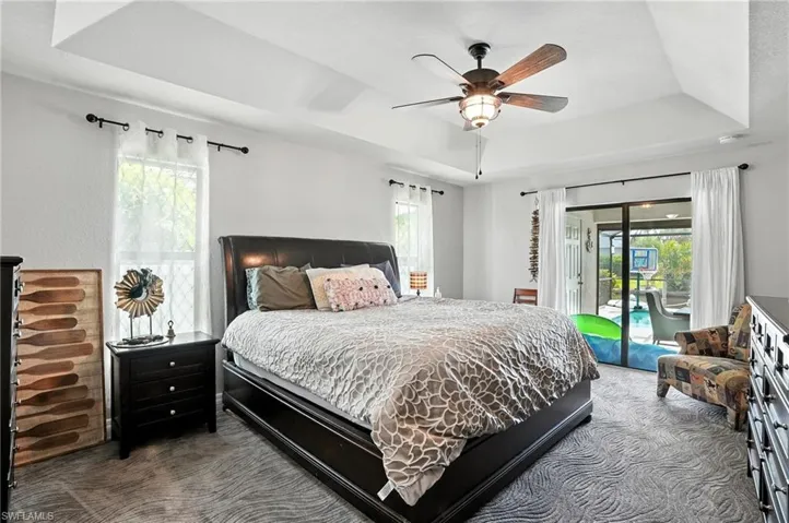 Bedroom featuring light tile patterned flooring and ceiling fan
