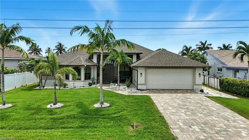 View of property location with a nearby body of water and nearby suburban area