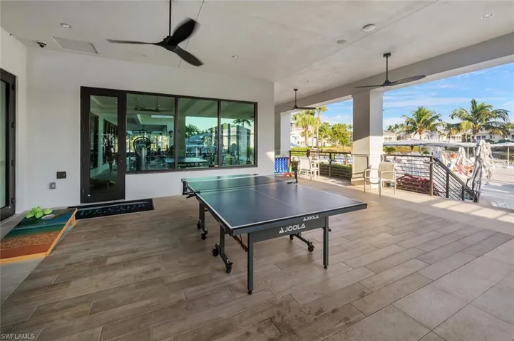 Ping pong at club house next to pool