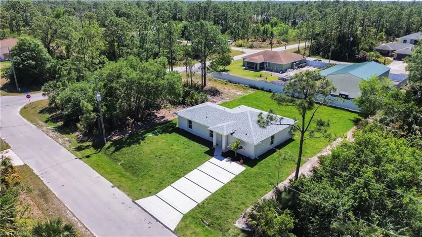 Aerial view featuring a forest view