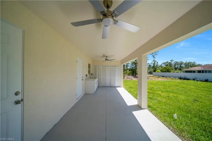 View of patio / terrace featuring a ceiling fan and fence