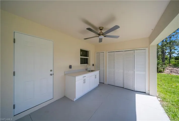 View of patio / terrace featuring area for grilling, a sink, and a ceiling fan