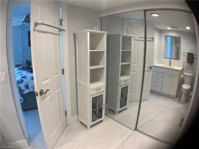 Bath has large closets and dressing area
