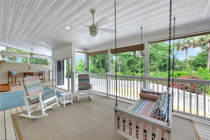 Sunroom featuring ceiling fan and healthy amount of natural light