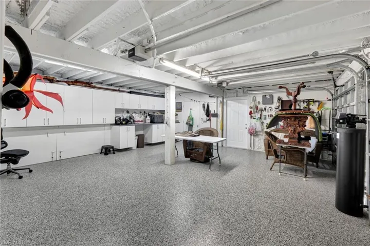Garage featuring a garage door opener
