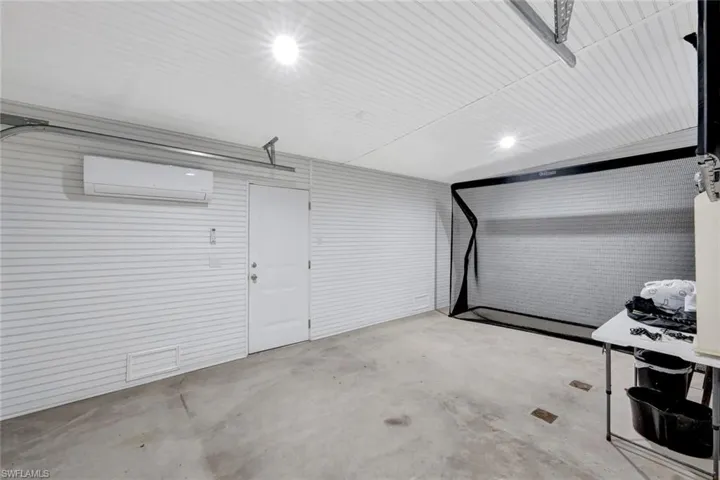 Garage with a wall mounted air conditioner