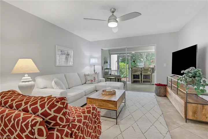 Living room with access to sitting room, northern exposure; primary bedroom to the right