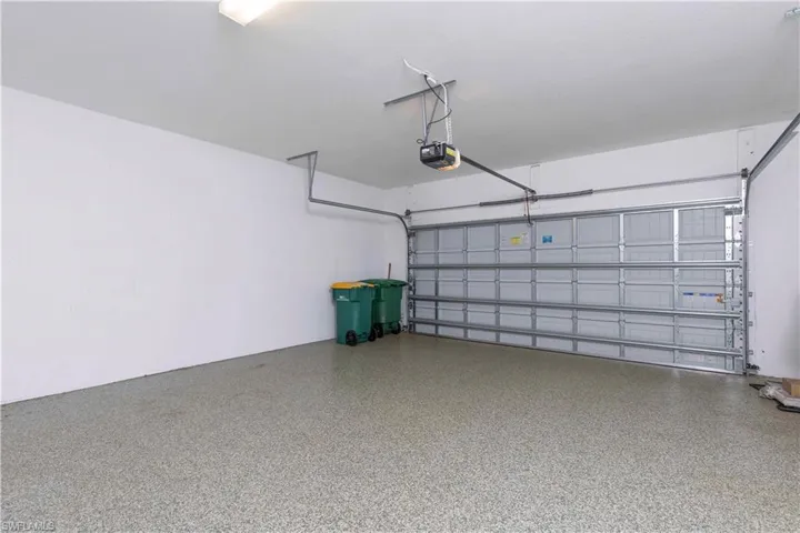 Garage featuring a garage door opener