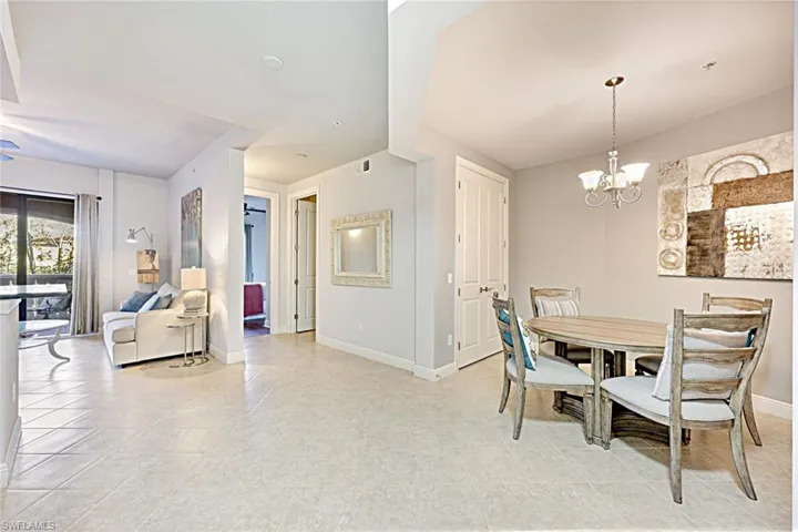 Dining area featuring a chandelier and light tile patterned floors