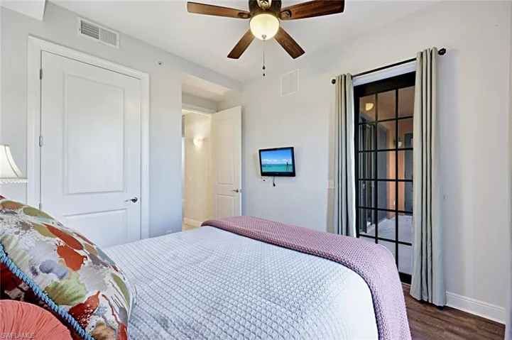 Bedroom featuring ceiling fan and wood finished floors