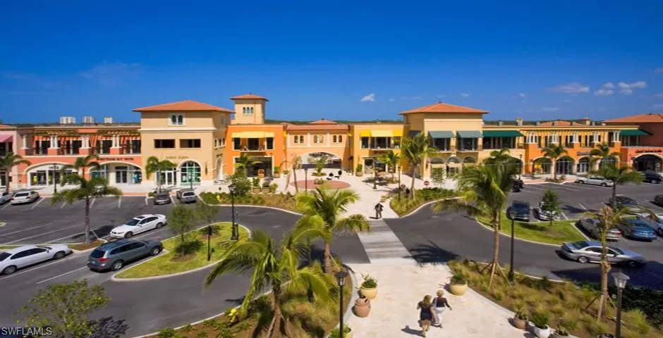 View of property featuring uncovered parking