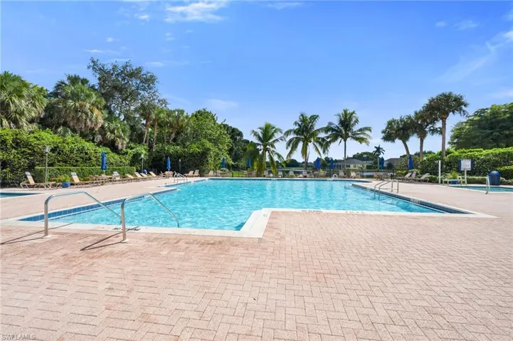 Community pool featuring a patio