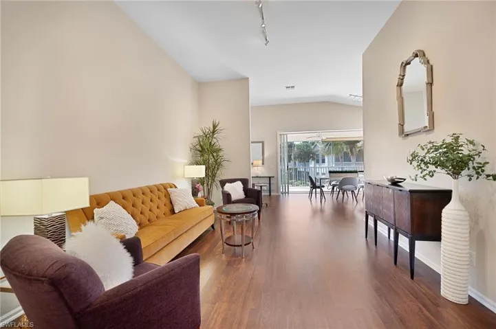 Living area featuring lofted ceiling