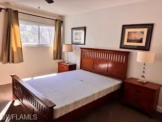 Bedroom with ceiling fan and baseboards