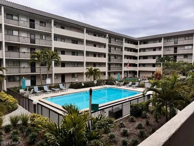 Community pool with a patio