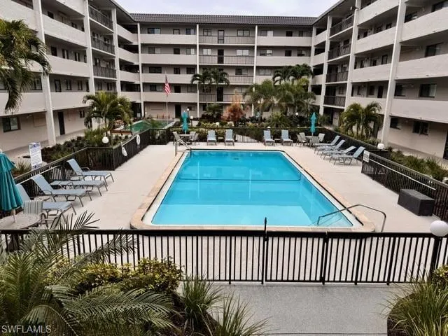 Community pool with a patio area