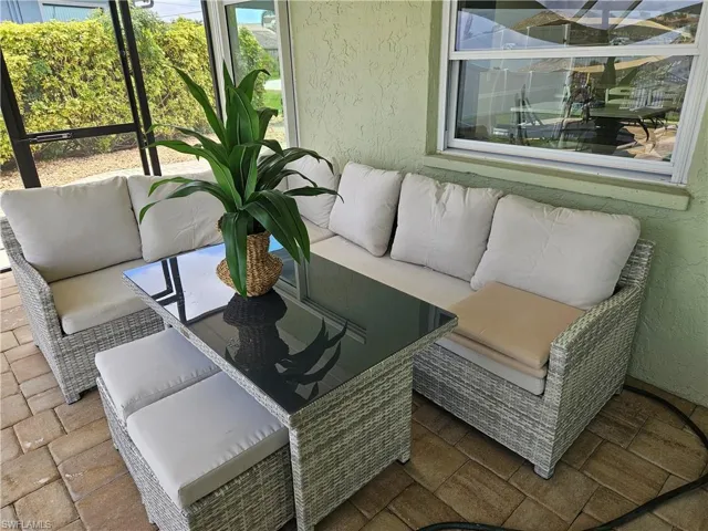 Sunroom / solarium with an outdoor living space
