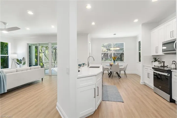 Clean, white quartz counter, shaker-style cabinetry, and new appliances await your culinary creations