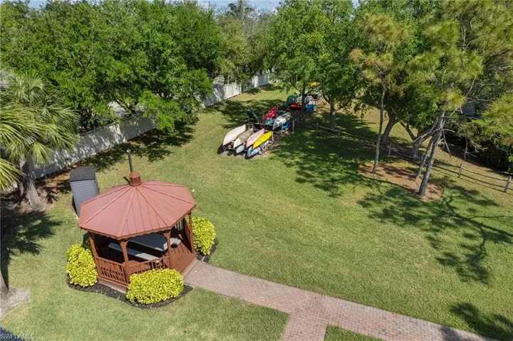 The canoe and kayak launch provides direct access to the Koreshan State Park and the Gulf of Mexico, perfect for water enthusiasts. A picturesque picnic area and gazebo add to the community's charm, inviting residents to relax and socialize in a serene environment.