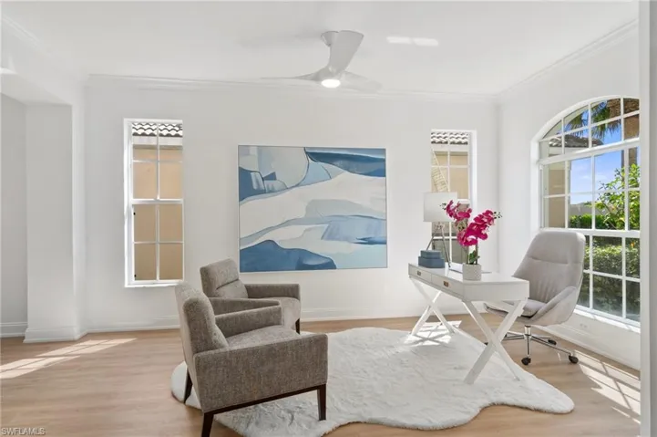 Space to the right of the entry has an abundance of natural light and might make an ideal home office