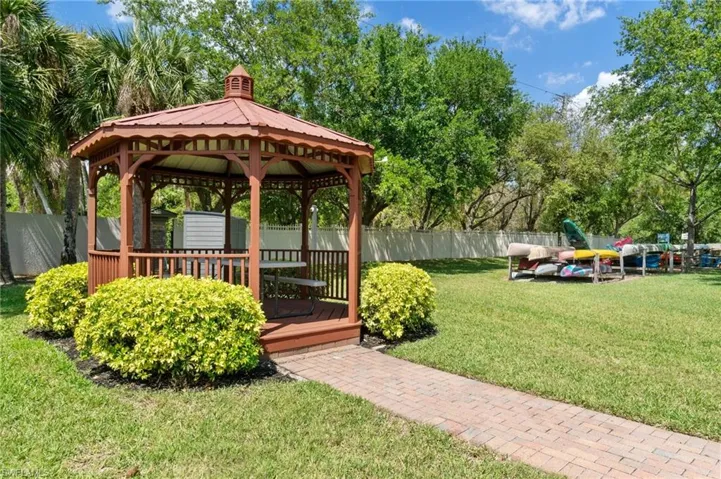 A picturesque picnic area and gazebo add to the community's charm, inviting residents to relax and socialize in a serene environment.