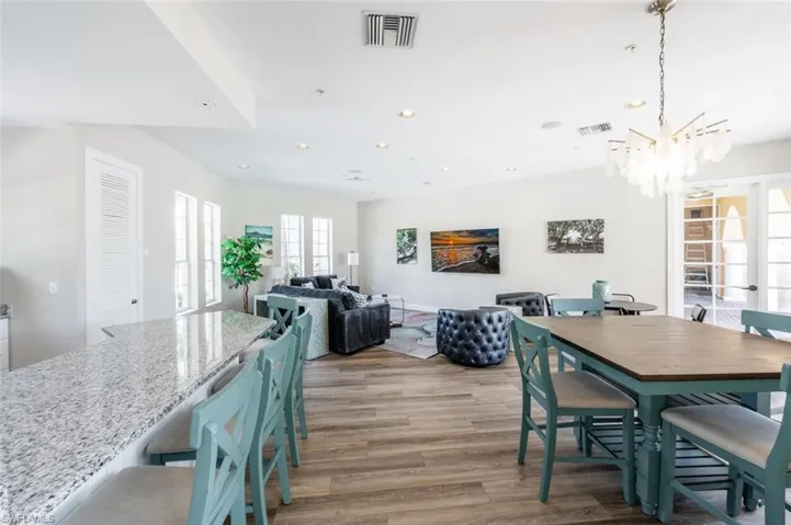 Dining space featuring light wood-style floors, visible vents, and recessed lighting