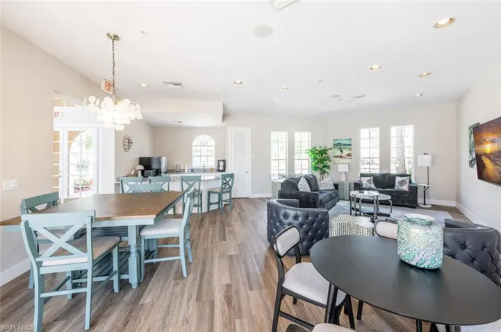 Dining area featuring recessed lighting, visible vents, light wood-style flooring, a chandelier, and baseboards