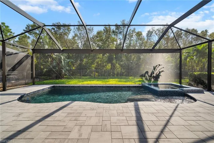 View of swimming pool featuring an in ground hot tub, HUGE LANAI, and a lanai