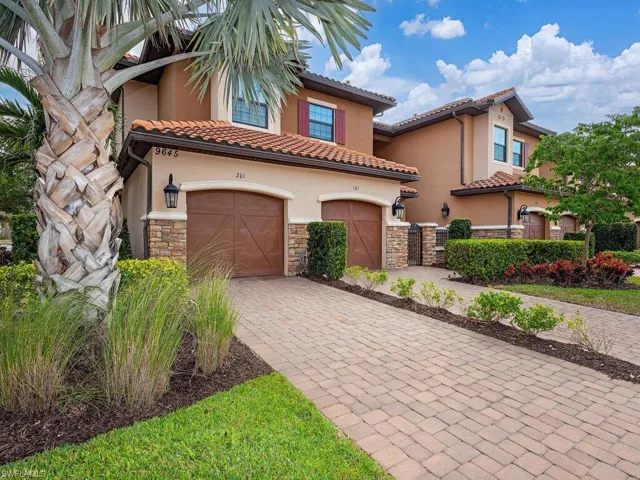 Single car garage in a beautifully landscaped coach home property