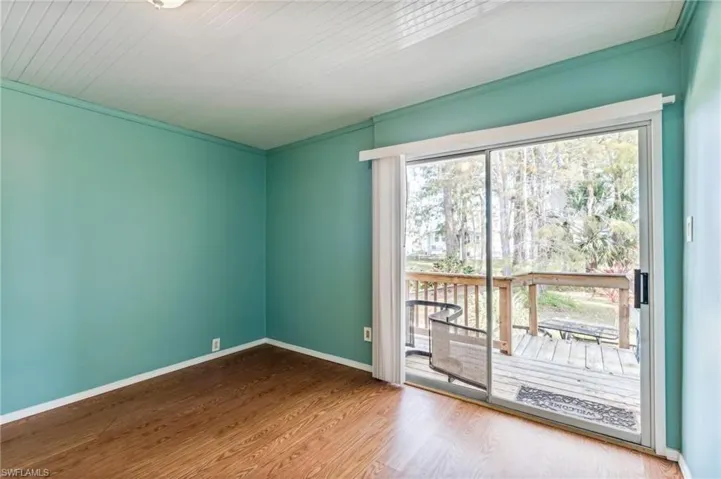 Den/spare room with slicing glass doors  baseboards