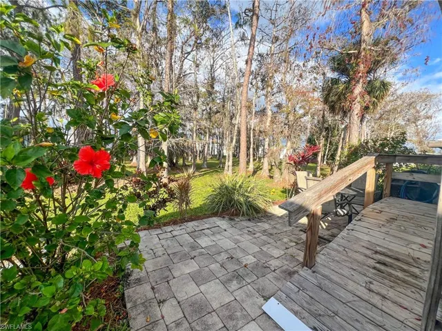 Wooden deck featuring a patio area