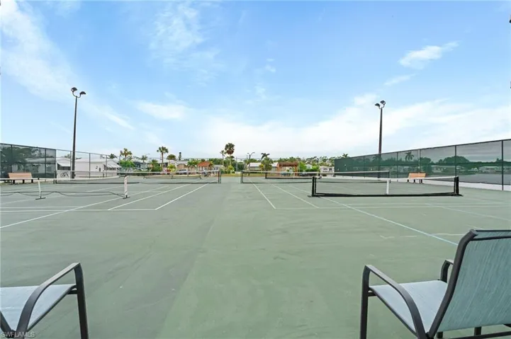 View of sport court featuring fence