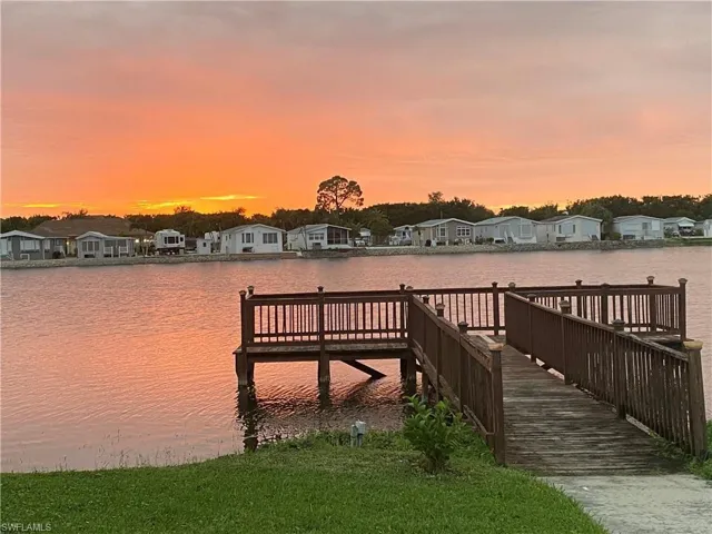 View of dock with a water view and a residential view