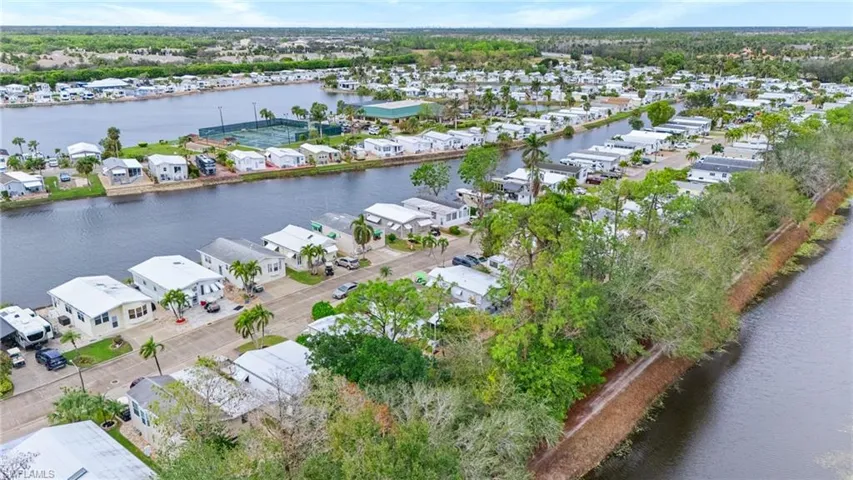 Aerial view featuring a residential view and a water view
