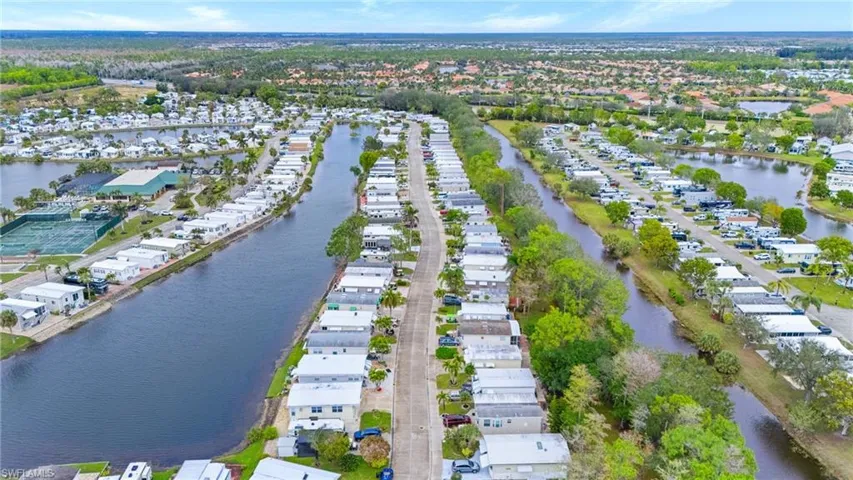 Aerial view featuring a residential view and a water view