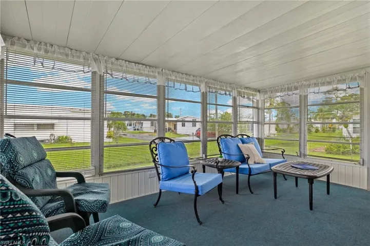 Sunroom / solarium with a wealth of natural light