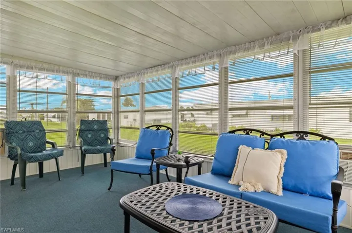 Sunroom with wooden ceiling